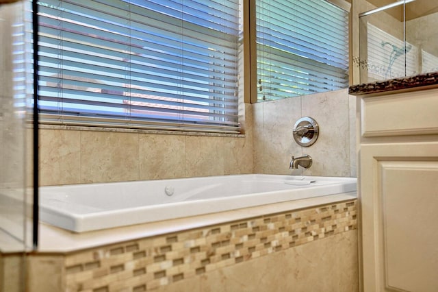 bathroom featuring a garden tub and walk in shower