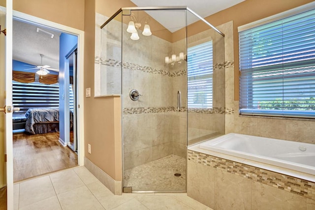 ensuite bathroom featuring a bath, a shower stall, ensuite bathroom, and tile patterned flooring