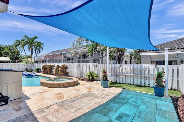 view of patio with an in ground hot tub, a fenced in pool, and a fenced backyard