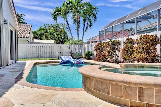 view of swimming pool featuring a fenced in pool, a fenced backyard, glass enclosure, and an in ground hot tub