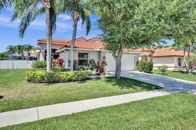 mediterranean / spanish home with a garage, fence, stucco siding, concrete driveway, and a tile roof