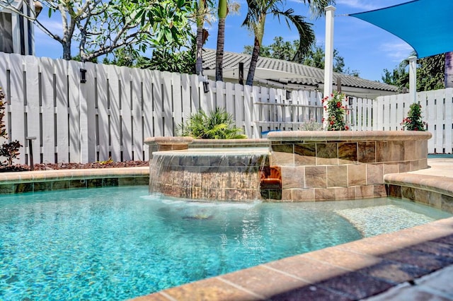 view of swimming pool with a fenced in pool and fence