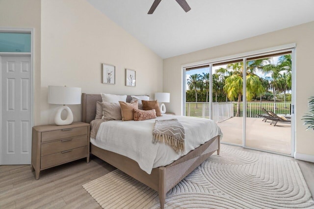 bedroom with light wood-style floors, access to outside, a ceiling fan, and vaulted ceiling
