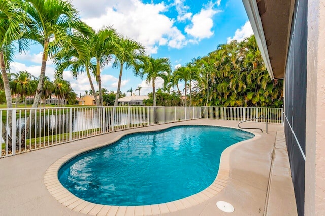 view of pool with a fenced in pool, a water view, a fenced backyard, and a patio
