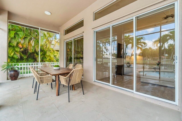 sunroom / solarium with outdoor dining space