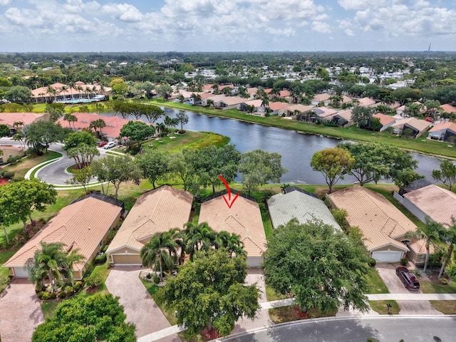 aerial perspective of suburban area featuring a nearby body of water