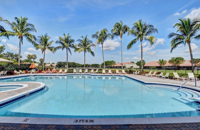 community pool featuring fence, a patio area, and a community hot tub