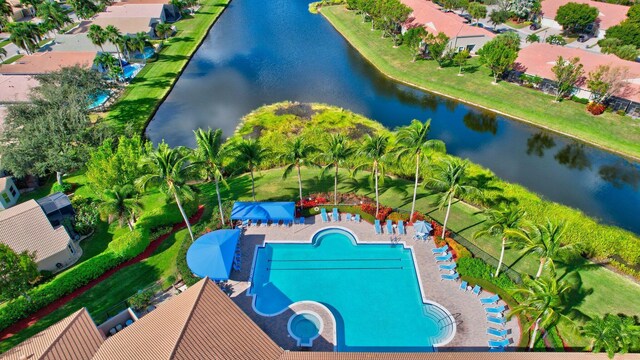 bird's eye view of a nearby body of water and a pool