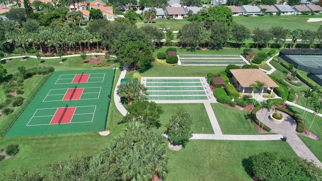 aerial view of property and surrounding area featuring nearby suburban area