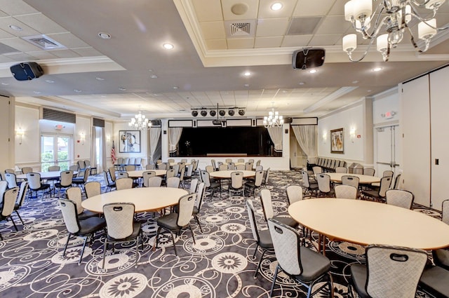 carpeted dining area featuring a chandelier, a raised ceiling, and ornamental molding
