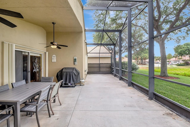 sunroom / solarium featuring a ceiling fan and outdoor dining area