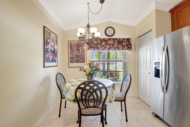 dining space featuring a chandelier, ornamental molding, baseboards, lofted ceiling, and light tile patterned floors