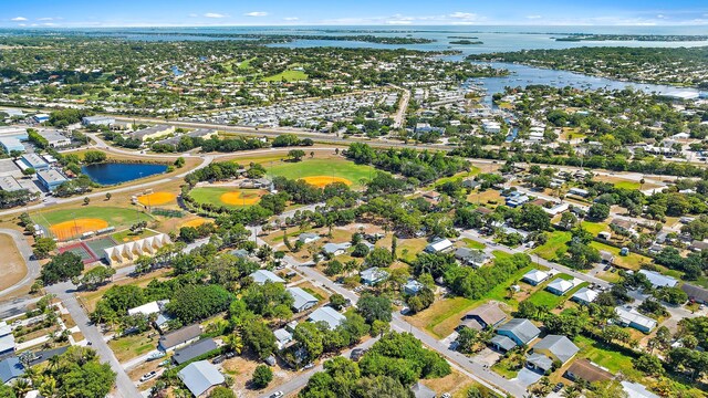 drone / aerial view with a water view and a residential view