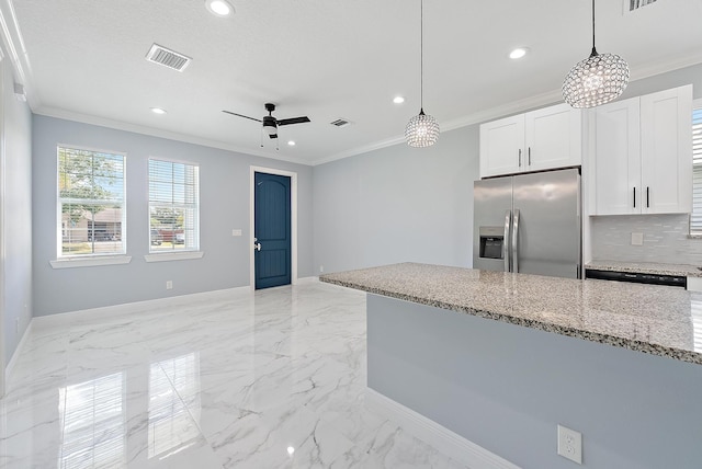 kitchen with light stone countertops, stainless steel fridge with ice dispenser, baseboards, visible vents, and ornamental molding