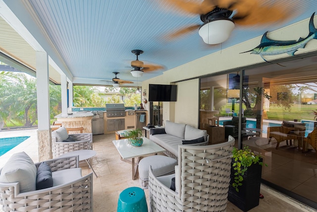 view of patio featuring exterior kitchen, ceiling fan, an outdoor pool, an outdoor living space, and a grill