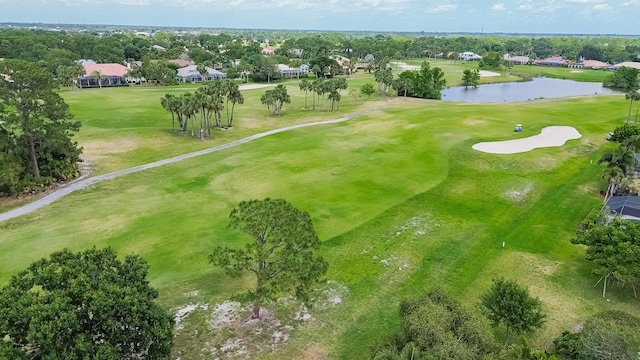 birds eye view of property featuring a water view, view of golf course, and a residential view