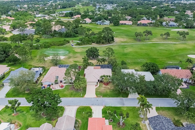 drone / aerial view with a residential view and golf course view