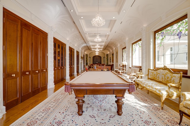 game room featuring pool table, arched walkways, light wood-style flooring, and a notable chandelier