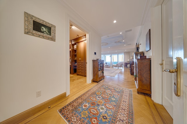 hallway featuring recessed lighting, ornamental molding, and baseboards