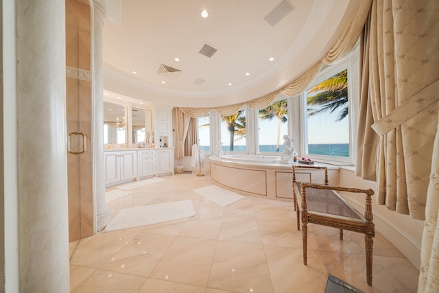 bathroom featuring a water view, recessed lighting, a bath, and visible vents