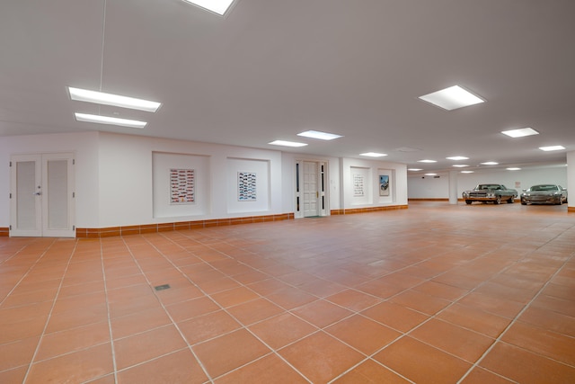 tiled empty room with baseboards