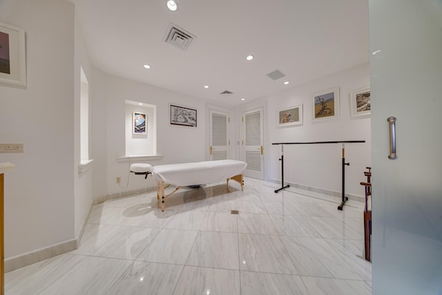 hallway with visible vents, recessed lighting, and baseboards