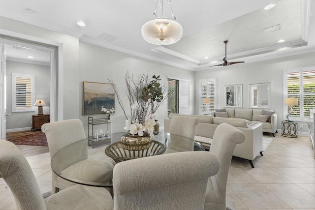 10245 SW Reggiani Rd, Port Saint Lucie, FL 34986 - dining space with crown molding, ceiling fan, light tile patterned flooring, and visible vents