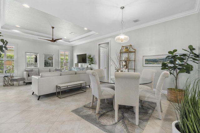 10245 SW Reggiani Rd, Port Saint Lucie, FL 34986 - dining area featuring visible vents, ornamental molding, light tile patterned flooring, recessed lighting, and a tray ceiling