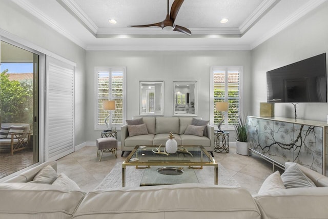 10245 SW Reggiani Rd, Port Saint Lucie, FL 34986 - living room with crown molding, a raised ceiling, ceiling fan, and tile patterned floors