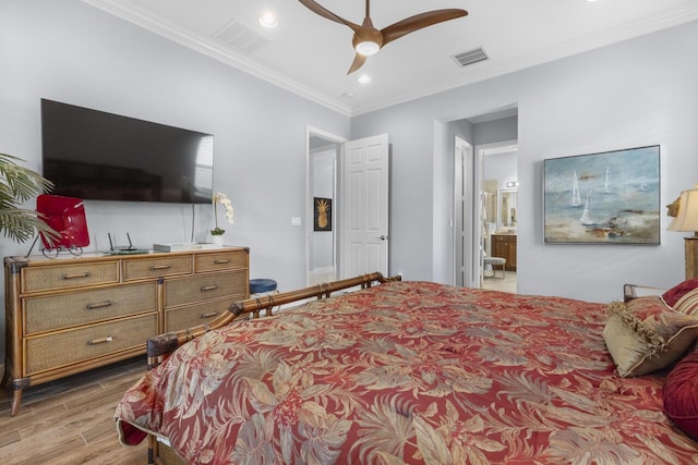 10245 SW Reggiani Rd, Port Saint Lucie, FL 34986 - bedroom featuring visible vents, ornamental molding, wood finished floors, and ensuite bathroom