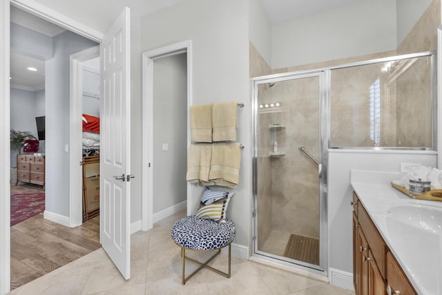 10245 SW Reggiani Rd, Port Saint Lucie, FL 34986 - full bath with vanity, ornamental molding, tile patterned flooring, baseboards, and a shower stall
