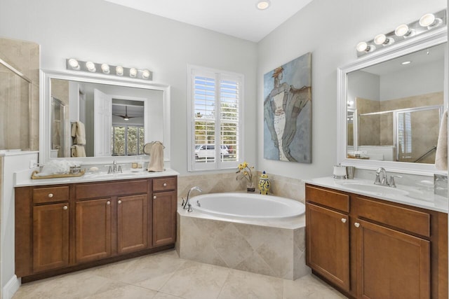 10245 SW Reggiani Rd, Port Saint Lucie, FL 34986 - bathroom with a sink, tile patterned floors, a shower stall, and a garden tub