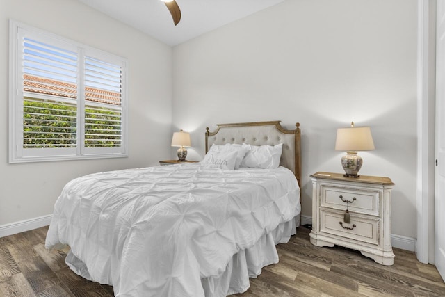 10245 SW Reggiani Rd, Port Saint Lucie, FL 34986 - bedroom featuring a ceiling fan, baseboards, and wood finished floors