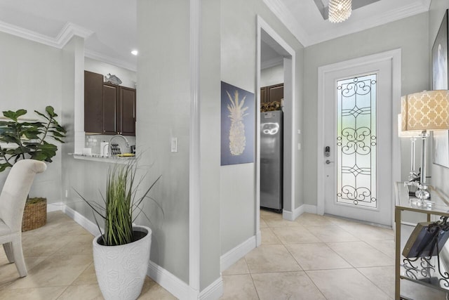 10245 SW Reggiani Rd, Port Saint Lucie, FL 34986 - foyer entrance featuring crown molding, baseboards, and light tile patterned floors