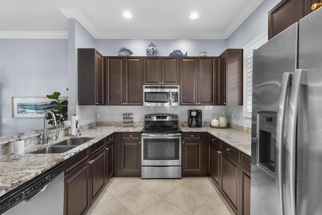 10245 SW Reggiani Rd, Port Saint Lucie, FL 34986 - kitchen with a sink, dark brown cabinetry, light tile patterned flooring, and stainless steel appliances