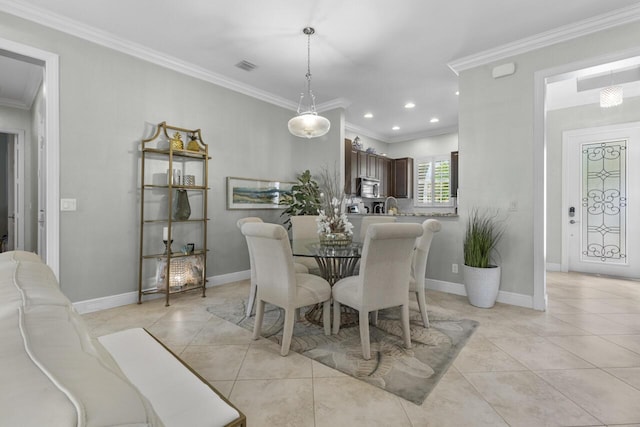 10245 SW Reggiani Rd, Port Saint Lucie, FL 34986 - dining room with light tile patterned floors, ornamental molding, and visible vents