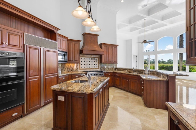 kitchen with dobule oven black, a towering ceiling, beamed ceiling, premium range hood, and a sink