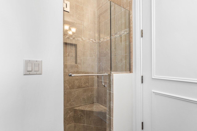 bathroom featuring a shower stall