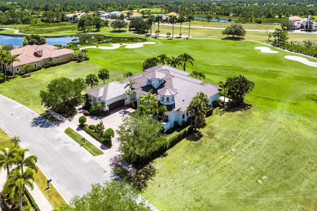 bird's eye view with a water view and view of golf course