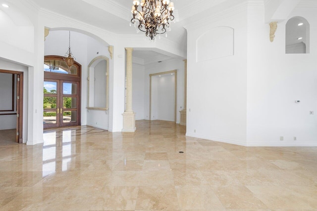 unfurnished room with arched walkways, ornamental molding, marble finish floor, and a chandelier