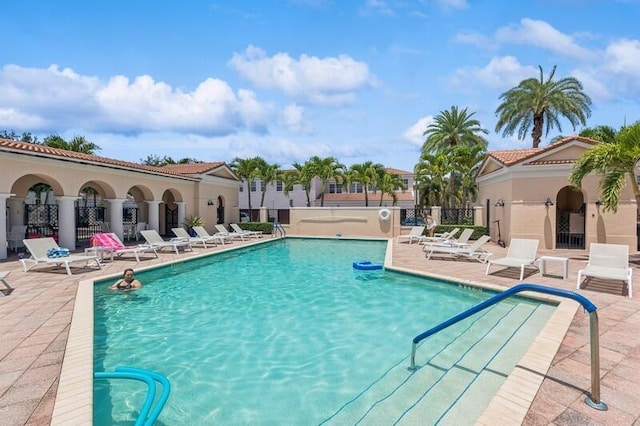 8292 NW 9th Ave, Boca Raton, FL 33487 - community pool with a patio area and fence