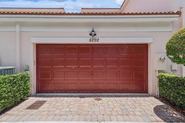 8292 NW 9th Ave, Boca Raton, FL 33487 - garage featuring driveway