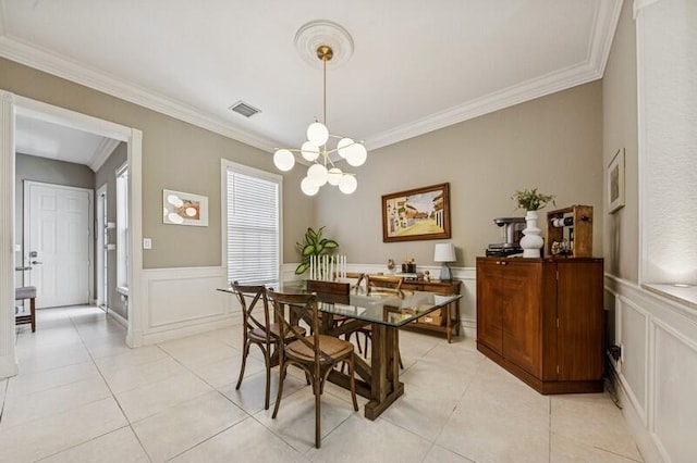 8292 NW 9th Ave, Boca Raton, FL 33487 - dining space featuring a chandelier, ornamental molding, light tile patterned floors, a decorative wall, and a wainscoted wall