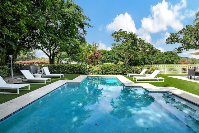 5607 NW 24th Ter, Boca Raton, FL 33496 - view of pool featuring a yard, a patio, a fenced in pool, and fence private yard