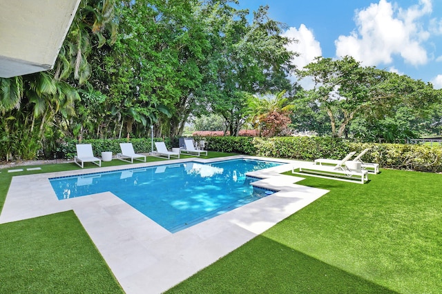 5607 NW 24th Ter, Boca Raton, FL 33496 - view of pool featuring a fenced in pool, a yard, and a patio area