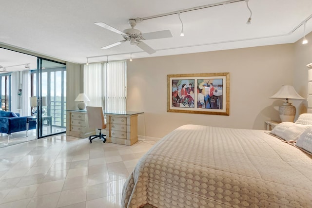 7578 Regency Lake Dr Unit 702, Boca Raton, FL 33433 - bedroom featuring expansive windows, rail lighting, ceiling fan, baseboards, and access to exterior
