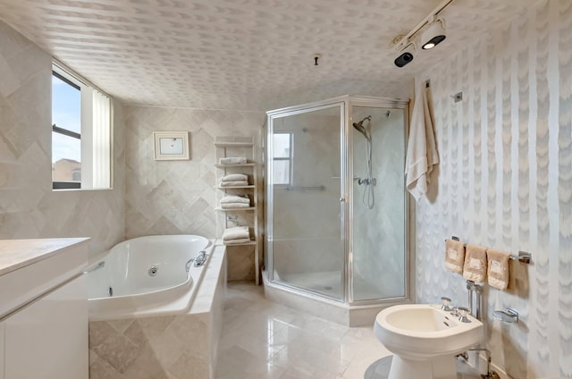 7578 Regency Lake Dr Unit 702, Boca Raton, FL 33433 - full bathroom with a bidet, a whirlpool tub, a shower stall, and wallpapered walls