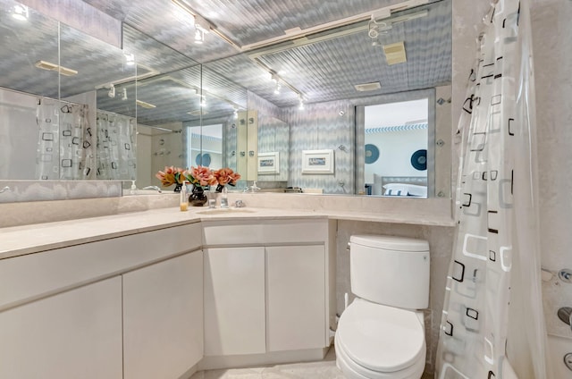7578 Regency Lake Dr Unit 702, Boca Raton, FL 33433 - bathroom featuring a stall shower, vanity, toilet, and track lighting