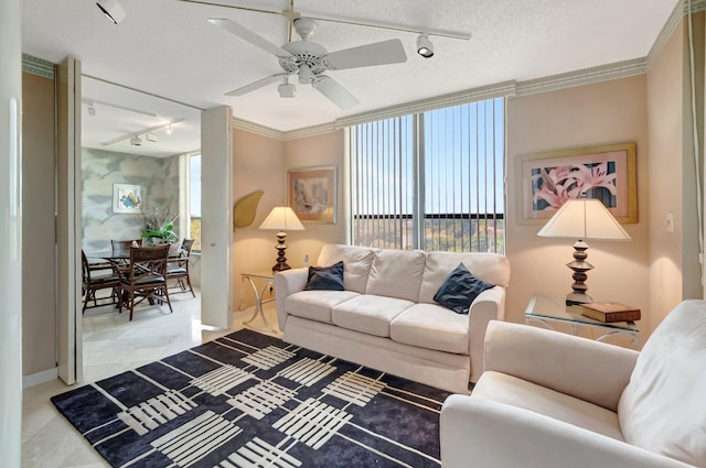 7578 Regency Lake Dr Unit 702, Boca Raton, FL 33433 - tiled living area featuring rail lighting, a textured ceiling, baseboards, and a ceiling fan