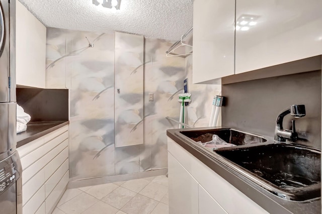 7578 Regency Lake Dr Unit 702, Boca Raton, FL 33433 - bathroom with tile patterned flooring, a textured ceiling, a walk in shower, and vanity